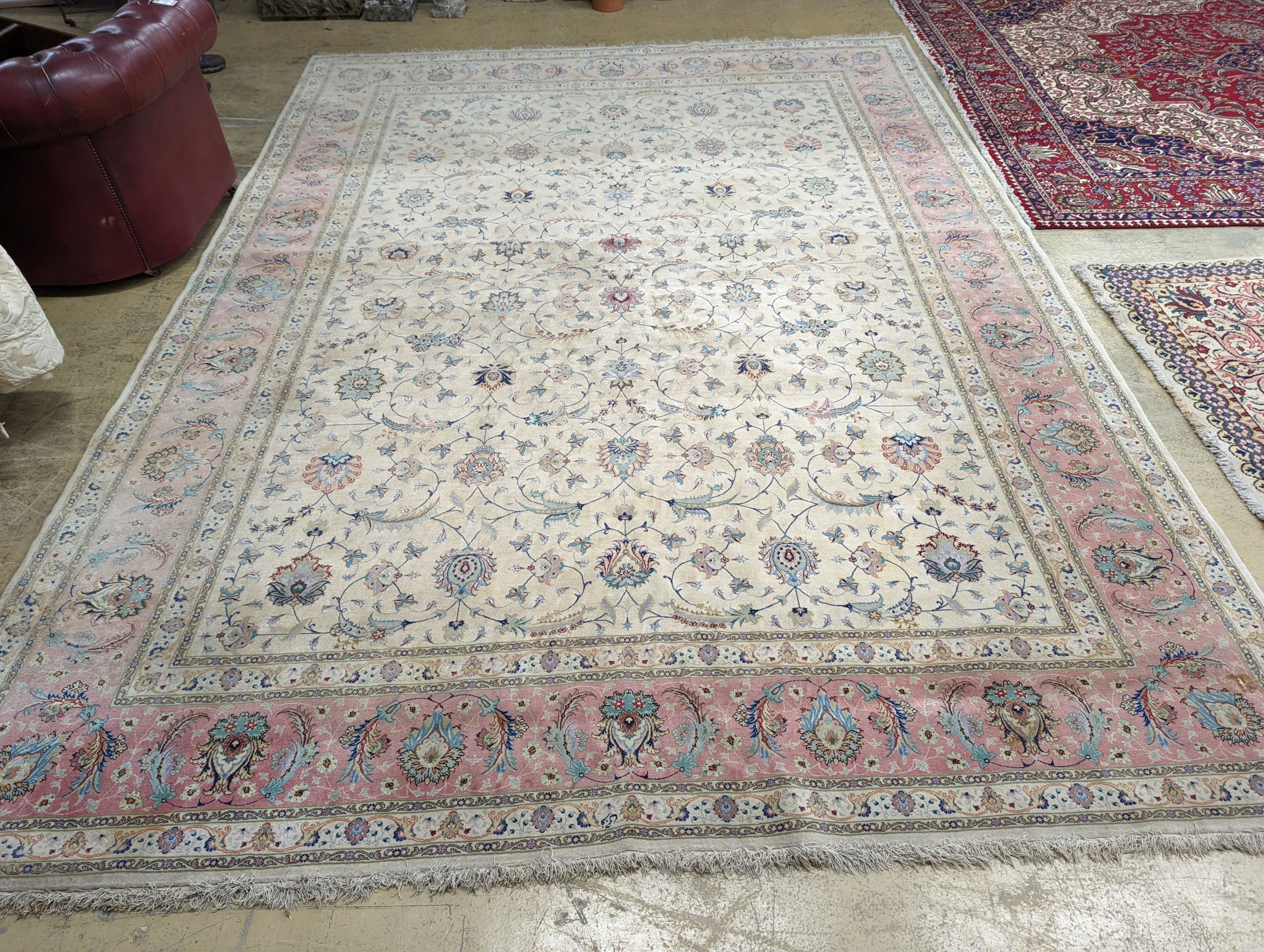 A Persian Tabriz ivory ground carpet, 410 x 300cm